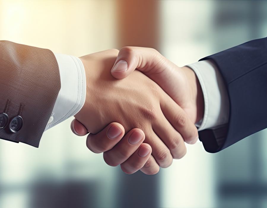 Attorney shaking hands with a client after a case resolution